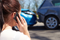 Woman on the phone at the scene of the accident